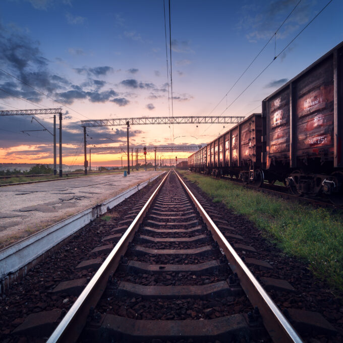 Cargo train platform at sunset. Railroad in Ukraine. Railway sta