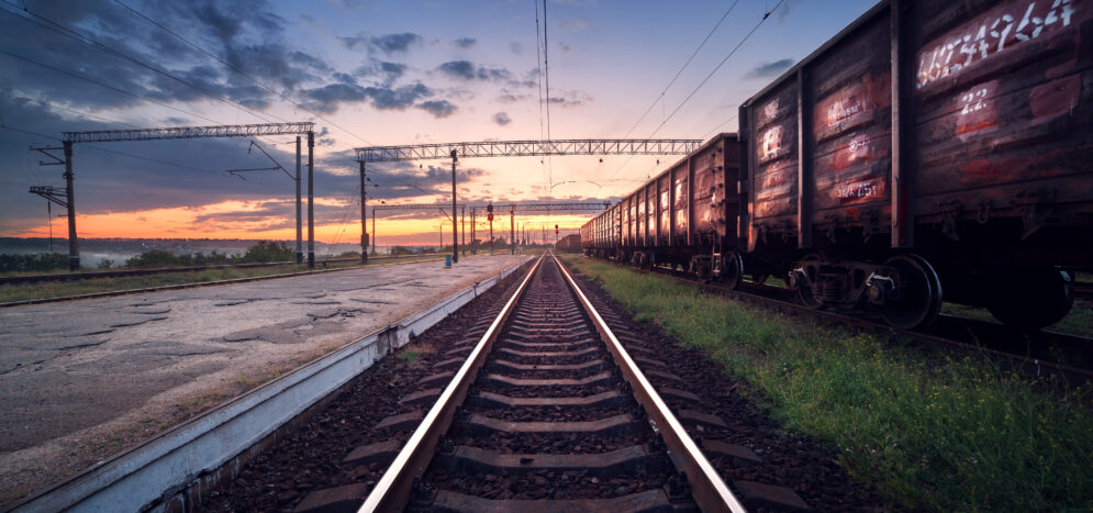 Cargo train platform at sunset. Railroad in Ukraine. Railway sta